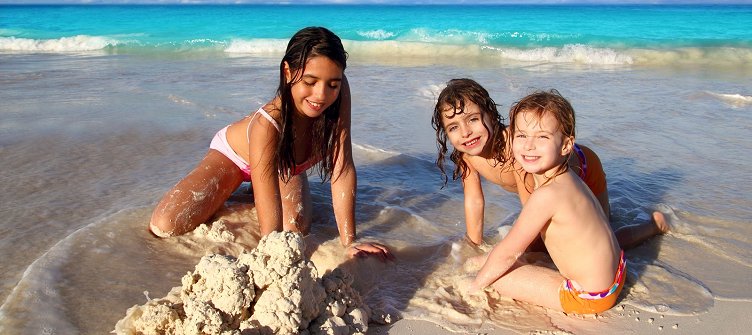 Children playing at a beach in Barbados island