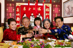Chinese family dining and toasting